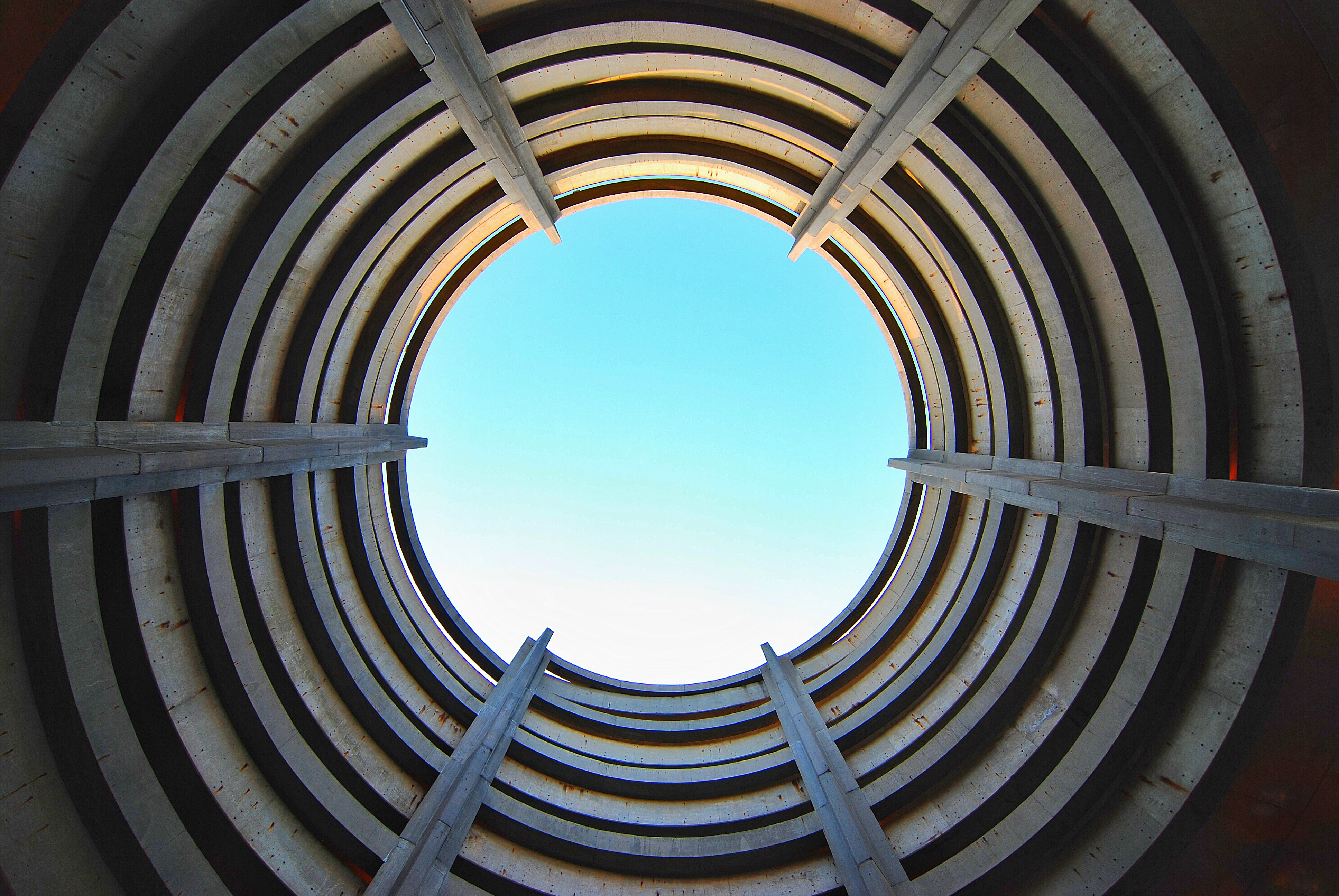 Metal tunnel pointing towards sky