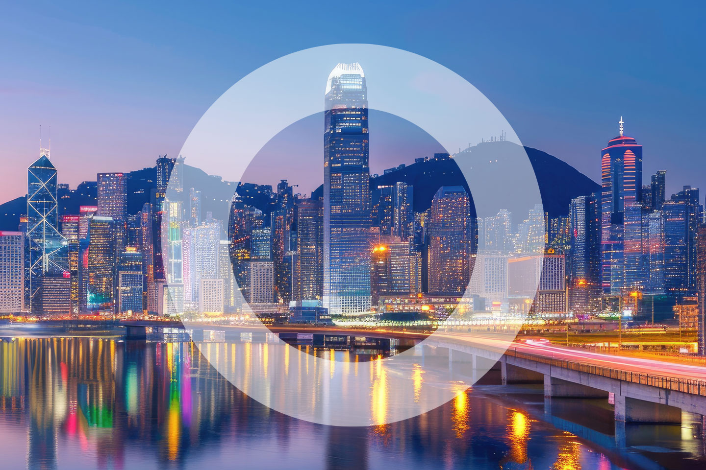 Hong Kong skyline at dusk with it's reflection on water below