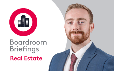 Boardroom Briefings Real Estate branding with illustrated city buildings logo with Matthew French