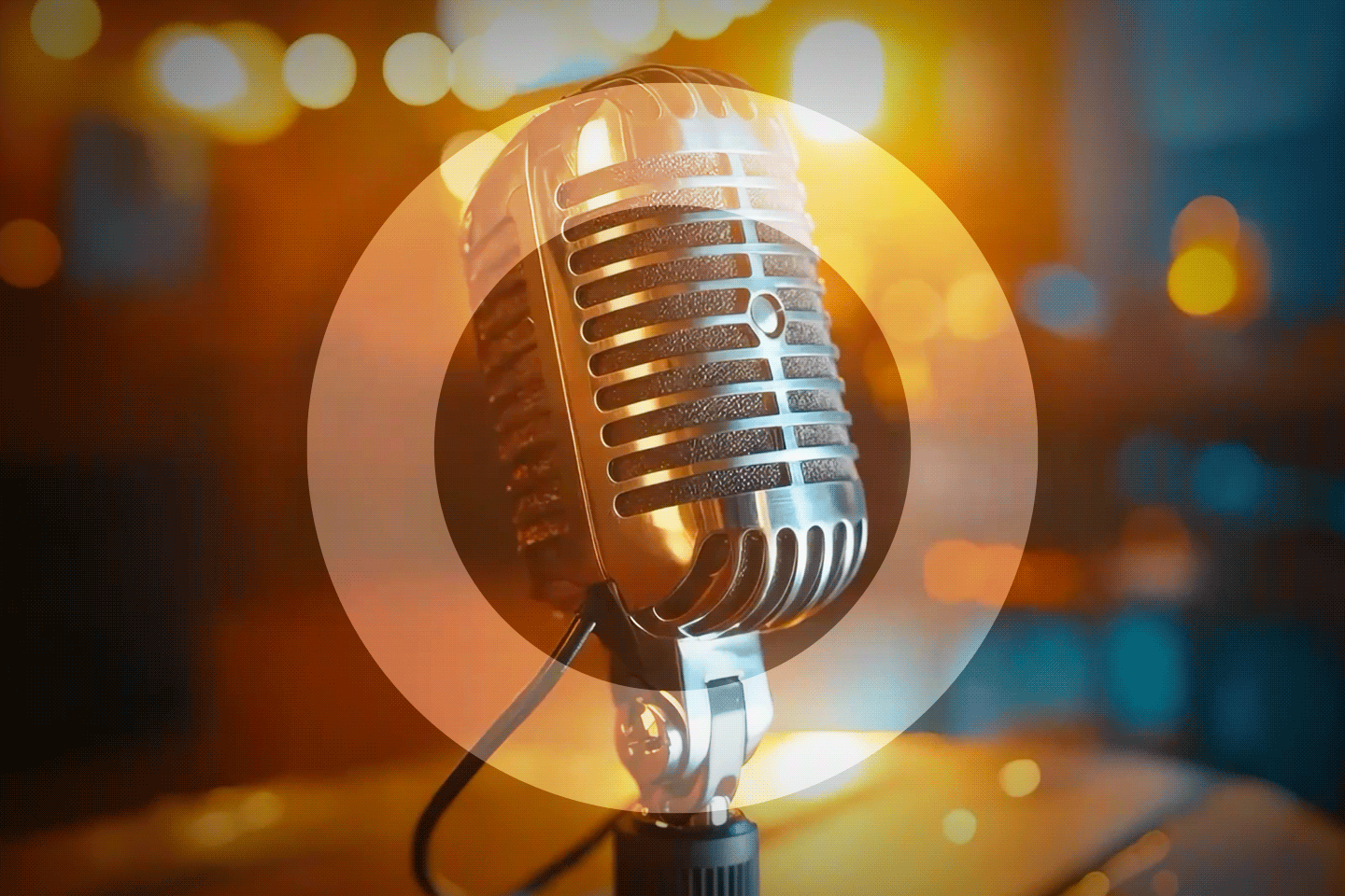 Retro microphone on a stage with a stage-lit background