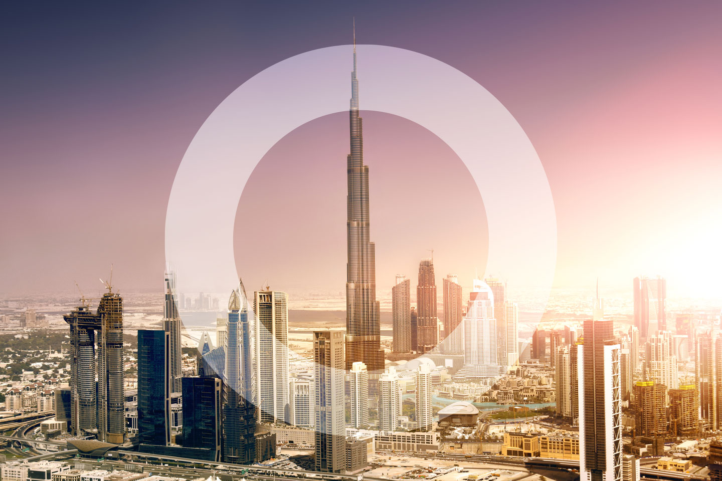 Dubai skyline at dusk with overlayed 'O'